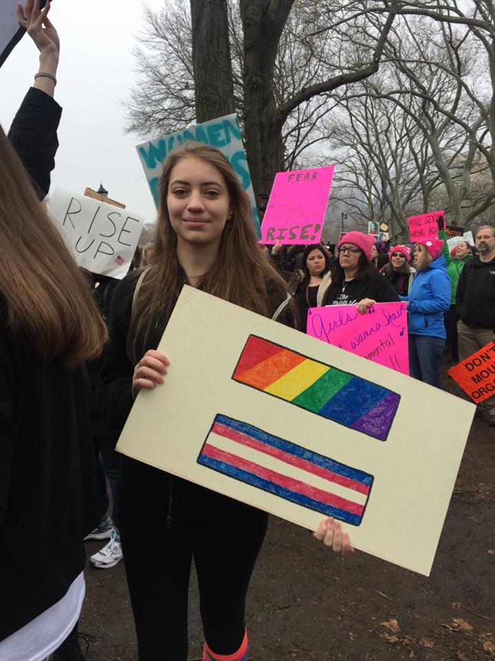 girl holding LGBT and trans flag equal sign, Women's March Philadelphia, Jan 21, 2017