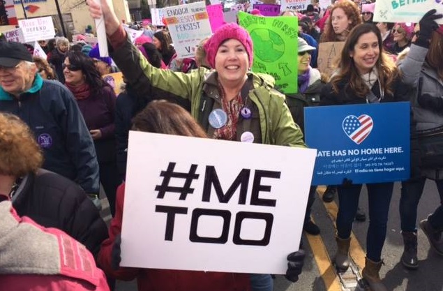 Peggy Farrelly at a rally with #MeToo sign