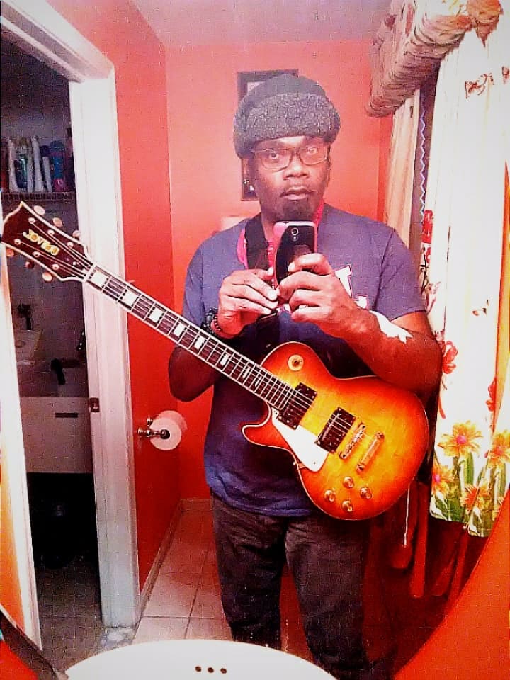 John Cecil Price - selfie with guitar