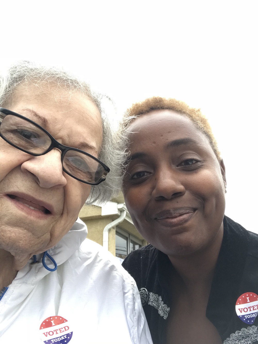 Arretta Cuff and Robin Renée wearing "I Voted" stickers after the 2018 U.S. midterm elections