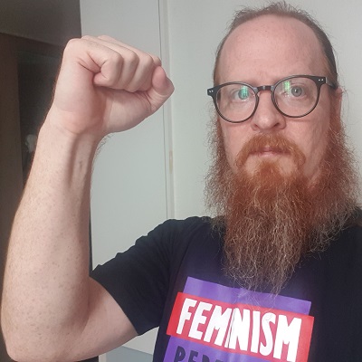 Kurt Esslinger wearing a feminism t-shirt
